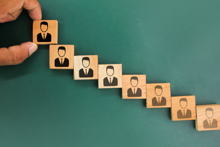 rosewood arrangement with people icons. the concept of improvement or development. growth of people. business development to success and growing growth conceptの写真素材