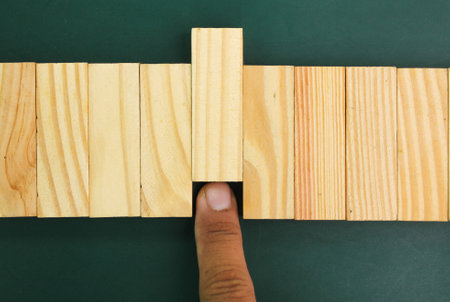 hands push a stick in order. the concept of selection or rejectionの写真素材