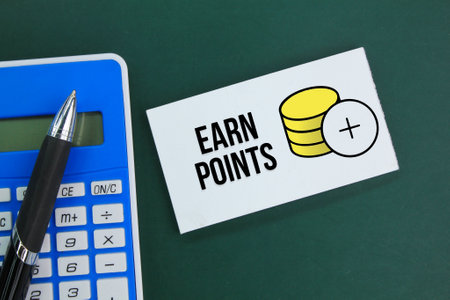 calculator, pen and white paper with the word Earn Points. the concept of income or earning