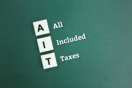 letters of the alphabet AIT or with the word All Included Taxes. business concept on business taxの写真素材