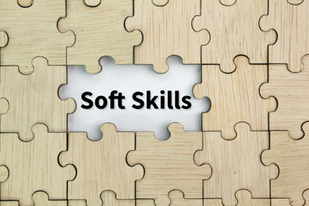 wooden puzzle with white in the middle with the word Soft skillsの写真素材