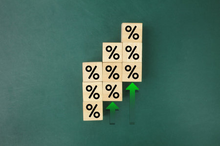 wood block stacking as step stair with sign percent and arrow up symbol. Interest rate financial and...