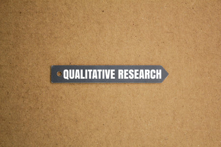 tag the paper with the word Qualitative Researchの写真素材