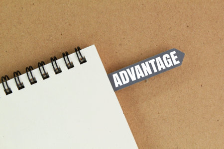 book and tag with the word advantage. the concept of the advantage of someone or somethingの写真素材