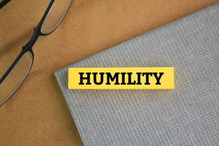 glasses and paper colored with the word Humilityの写真素材