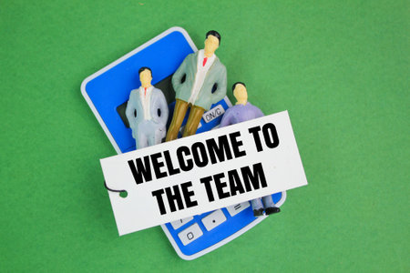 calculator with the words welcome to the team. new member entry concept. the concept of hiring new employees. the concept of teamworkの写真素材