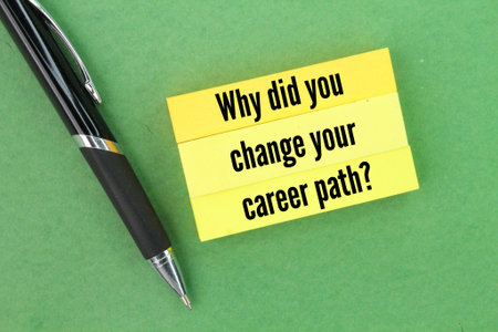 pen and colored paper with question words Why did you change your career path?