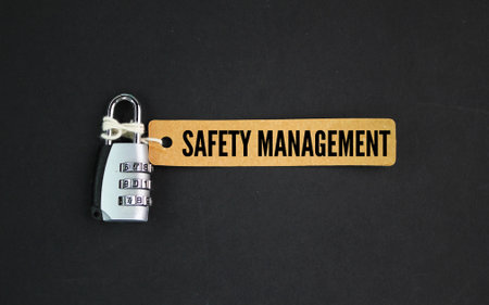 key and paper tag with the word safety management. safety concept