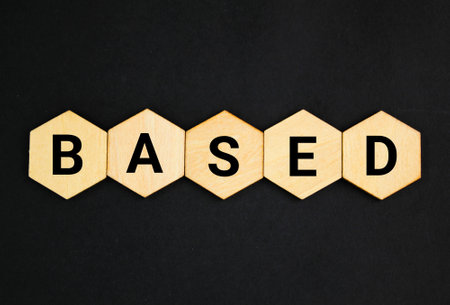 wooden hexagon with the word based. use as the foundation or starting point for somethingの写真素材