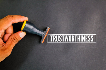 stamp with the word trustworthiness. the ability to be relied on as honest or truthfulの写真素材