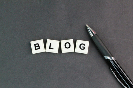 letters of the alphabet with the word blog. writing or narration. a regularly updated website or web page, typically one run by an individualの写真素材