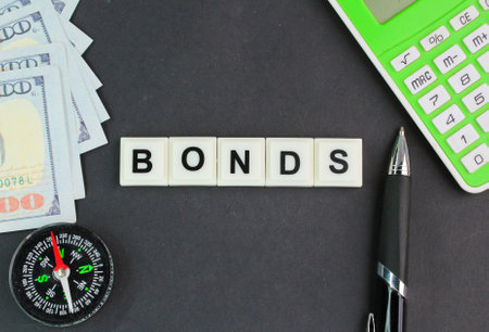 banknotes and letters of the alphabet with the word bonds.の写真素材