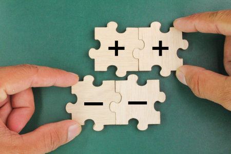 puzzle with two plus and minus symbols. mathematical concepts. positive and negative concepts. Progress and profit to benefit growth and development in businessの写真素材