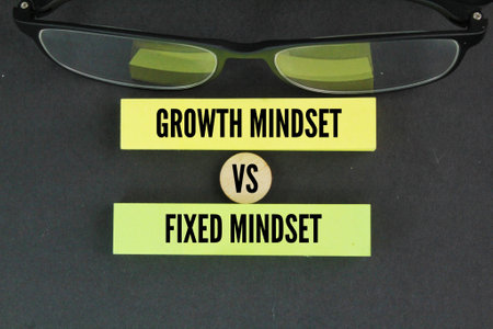 glasses with the words Fixed Mindset vs Growth Mindset. concept idea of ââchoosing the right strategyの写真素材