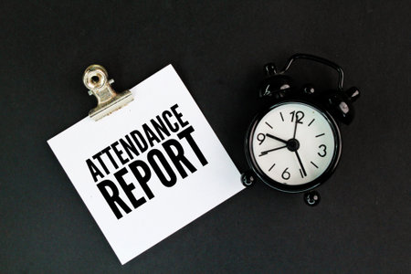 white paper with the words attendance report. formal document that records the presence or absence of individuals at a specific event, meeting, or period, typically used in educatiの写真素材