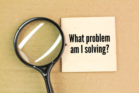 magnifying glass with question word What problem am I solving? Q and A conceptの写真素材