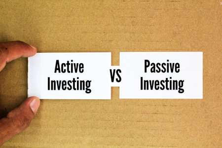 white paper with the words Active Investing vs Passive Investing. two different approaches to managing an investment portfolio, each with its own strategy, benefits.の写真素材