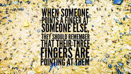 words of inspiration and motivation When someone points a finger at someone else, they should remember that their three fingers are pointing at them.の写真素材