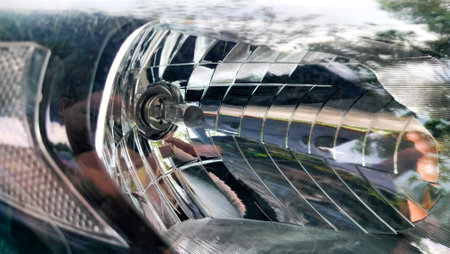close up front headlight or headlamp. The car's front bulb inside the headlight coverの写真素材