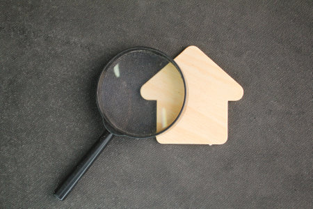 House shape and magnifying glass. the concept of finding a home. buying or moving house concept. House searching concept. Home appraisal. Property valuation.の写真素材
