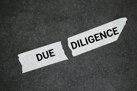 torn sticker with the word due diligence. the concept of self-integrity. the concept of persistenceの写真素材