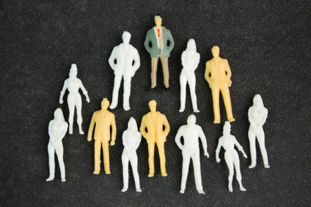 a group of miniature business people. Leadership Figurine Concept. businessman standing and working.