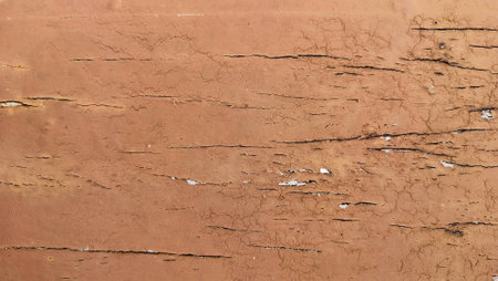old wooden background planks, outdoor picture. worn brown paint on wood. Aged wooden surface with peeling flaky red-brown paint, texture for background.の写真素材
