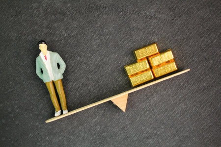 balance between people and gold, weight to people. the concept of the value of a person or a leader. human values ââand material wealth. It reflects the struggle to maintain ethicaの写真素材