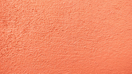 Old orange grunge texture background. cement or concrete texture background colored orange. Orange wall background with rough surface.Abstract orange cement wall textureの写真素材