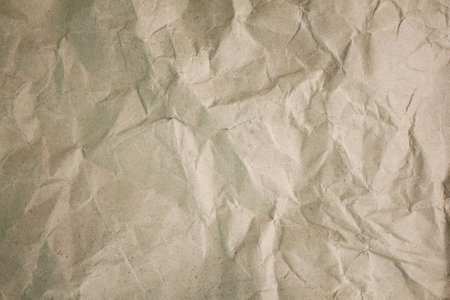 Old crumpled beige paper. crumpled brown paper background. blank brown paper texture backgroundの写真素材