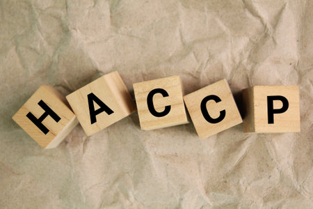 wooden block with the letters HACCP or the word Hazard Analysis Critical Control Points