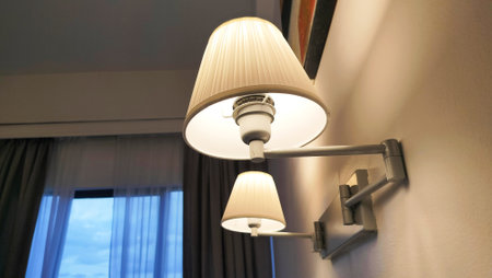 a pair of hotel room lamps. Retro lamp attached to the wall.