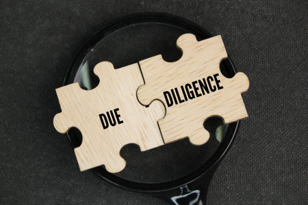wooden puzzle with the word due diligence. the concept of self-integrity. the concept of persistenceの写真素材