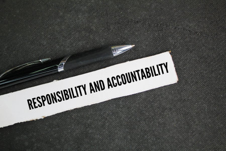 pen and paper with the words responsibility and accountabilityの写真素材