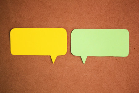 two examples of green and yellow conversation columns. Comic speech balloon. paper speech bubble. conversation conceptの写真素材