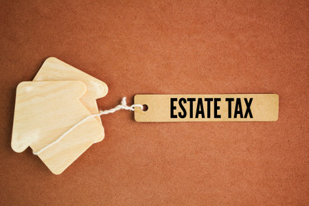 house form and paper tag with the word Estate Tax. another term for inheritance tax.の写真素材
