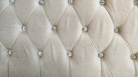 Chair fabric texture background with buttons. Cream Fabric Upholstery Background. seamless white leather texture or backgroundの写真素材