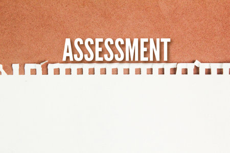 torn paper with the word assessment. the action of assessing someone or something.の写真素材