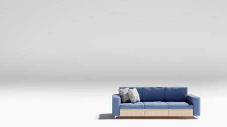Blue sofa with teak wood frame with two pillows and white backgroundの写真素材