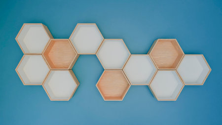 Top view of wooden hexagon on blue background.の写真素材