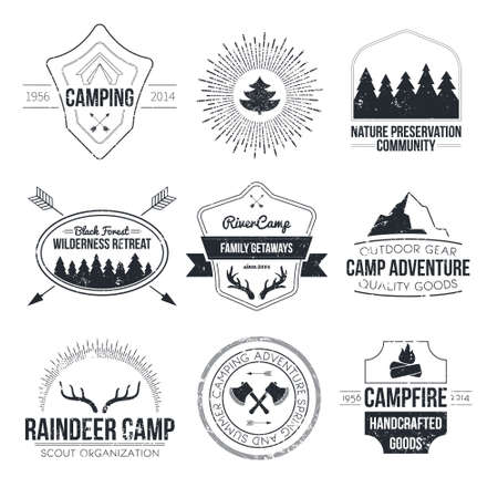 Set of vintage camping and outdoor activity logos. Vector logotypes and badges with forest, trees, mountain, campfire, tent, antlers.のイラスト素材