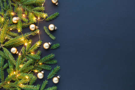 Christmas composition on black background - beautiful natural decorations and copy space for your greetings or textの写真素材