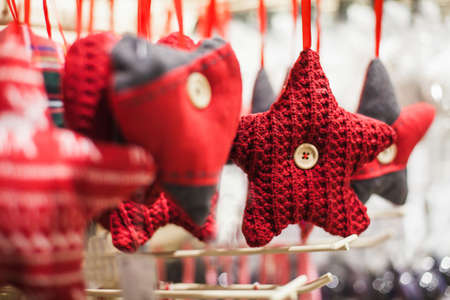 Christmas decor: red knitted stars and hearts.Close upの写真素材