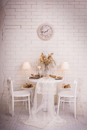 Christmas day interior design of white dining room. New Year winter backgroundの写真素材
