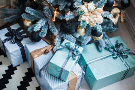 Gift boxes under Christmas tree. Close-upの写真素材