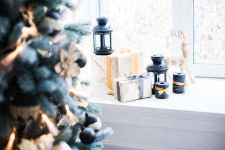 Christmas gift box at the window sill.の写真素材