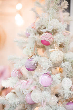 A branch of a Christmas tree decorated with ornaments. Close-upの写真素材
