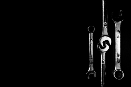 Wrench on the black background with hi-contrast monotone and low key style. With copy space.の写真素材