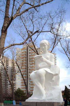 Reading girl sculptureの写真素材