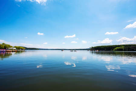 Blue sky and white clouds reflection summerの写真素材